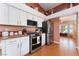 Well-equipped kitchen with stainless steel appliances, white cabinets, and granite countertops at 5528 Apache Wells Way, Las Vegas, NV 89130