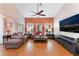 Spacious living room with sleek furnishings and a wall-mounted TV at 5528 Apache Wells Way, Las Vegas, NV 89130