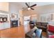 Inviting living room featuring a fireplace, high ceilings and open access to other living areas at 5528 Apache Wells Way, Las Vegas, NV 89130