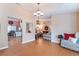 Open-concept living area with seamless flow between living and dining spaces and hardwood floors at 5528 Apache Wells Way, Las Vegas, NV 89130