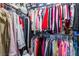 Walk-in closet with custom shelving and plenty of storage for clothing and shoes at 5528 Apache Wells Way, Las Vegas, NV 89130