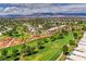 Panoramic aerial view of the golf course and residential community with mountain backdrop at 5604 Ocean Pines Cir, Las Vegas, NV 89130
