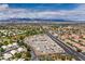 High aerial view shows the community with a recreational parking area with mountain views at 5604 Ocean Pines Cir, Las Vegas, NV 89130