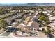 Stunning aerial view of a neighborhood with well-maintained homes and desert landscape at 5604 Ocean Pines Cir, Las Vegas, NV 89130