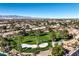Picturesque aerial view of the golf course and the surrounding neighborhood at 5604 Ocean Pines Cir, Las Vegas, NV 89130
