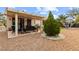 Inviting backyard with covered patio area and desert landscaping at 5604 Ocean Pines Cir, Las Vegas, NV 89130