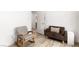 Simple bedroom featuring a rocking chair, love seat and bright walls at 5604 Ocean Pines Cir, Las Vegas, NV 89130
