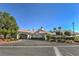 Beautiful clubhouse entrance with landscaped grounds, portico, and symmetrical design at 5604 Ocean Pines Cir, Las Vegas, NV 89130