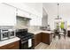 Bright kitchen with quartz countertops, stainless steel appliances and a stylish backsplash, ideal for cooking at 5604 Ocean Pines Cir, Las Vegas, NV 89130