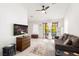 Inviting living room with tile flooring, flatscreen TV, French doors and a comfortable sofa at 5604 Ocean Pines Cir, Las Vegas, NV 89130