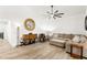 Spacious living room with ceiling fan, modern flooring, and comfortable seating arrangements at 5604 Ocean Pines Cir, Las Vegas, NV 89130