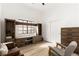 Bright living room with rustic entertainment center, light wood floors, and seating area at 5604 Ocean Pines Cir, Las Vegas, NV 89130
