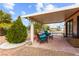 Comfortable covered patio seating area for relaxing and entertaining at 5604 Ocean Pines Cir, Las Vegas, NV 89130