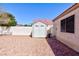 Well-kept backyard with low-water landscaping and convenient storage shed at 5927 Tropical Palm Ct, North Las Vegas, NV 89031
