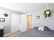 Bedroom featuring tile floors, closet, white door, and neutral paint at 5927 Tropical Palm Ct, North Las Vegas, NV 89031