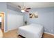Relaxing bedroom with ceiling fan, sliding closet door, and tile floors at 5927 Tropical Palm Ct, North Las Vegas, NV 89031
