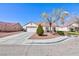 Inviting single-level home with a well-maintained yard and convenient two-car garage at 5927 Tropical Palm Ct, North Las Vegas, NV 89031