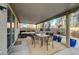 Inviting covered patio features a dining table and outdoor seating area at 6104 Talbot Springs Ct, North Las Vegas, NV 89081