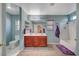 Bright bathroom featuring a double sink vanity and a shower-tub combo at 6104 Talbot Springs Ct, North Las Vegas, NV 89081