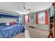 Cozy bedroom with bunk beds, carpeted floors, and ample natural light from the window at 6104 Talbot Springs Ct, North Las Vegas, NV 89081