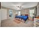 This main bedroom offers cozy decor, and is carpeted with great natural light at 6104 Talbot Springs Ct, North Las Vegas, NV 89081