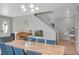 Bright dining space featuring wood floors, piano, aquarium, and staircase access at 6104 Talbot Springs Ct, North Las Vegas, NV 89081