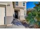 Charming entrance with a decorative front door, welcome sign, and well-kept landscaping at 6104 Talbot Springs Ct, North Las Vegas, NV 89081