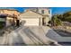 Two-story home featuring a spacious driveway and attached two-car garage at 6104 Talbot Springs Ct, North Las Vegas, NV 89081