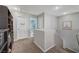 Carpeted hallway with multiple doors accessing the bathroom and other rooms at 6104 Talbot Springs Ct, North Las Vegas, NV 89081