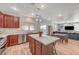 Modern kitchen with granite counters, stainless steel appliances, and an island overlooking the breakfast nook at 6104 Talbot Springs Ct, North Las Vegas, NV 89081