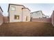 Low maintenance rock backyard with a block wall and rear exterior view at 6129 Rose Springs Ave, Las Vegas, NV 89130