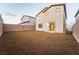 The large backyard has rock landscaping, block wall and sliding glass door at 6129 Rose Springs Ave, Las Vegas, NV 89130