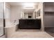 Spacious bathroom features a double vanity, large mirror, and a separate soaking tub at 6129 Rose Springs Ave, Las Vegas, NV 89130