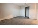 Bedroom featuring a sliding closet door and neutral walls, creating a serene and inviting space at 6129 Rose Springs Ave, Las Vegas, NV 89130