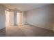 Spacious carpeted bedroom features neutral walls and a walk in closet at 6129 Rose Springs Ave, Las Vegas, NV 89130