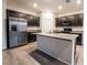 Kitchen featuring granite countertops, stainless steel appliances, and a spacious island at 6129 Rose Springs Ave, Las Vegas, NV 89130