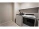 Laundry room with tile flooring, a Whirlpool washer and dryer at 6129 Rose Springs Ave, Las Vegas, NV 89130