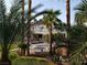 Beautiful backyard oasis with lush landscaping, pool, and patio furniture for relaxation at 7261 Obannon Dr, Las Vegas, NV 89117