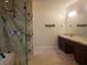 Primary bathroom featuring a marble shower and double vanity at 7261 Obannon Dr, Las Vegas, NV 89117