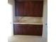 Elegant built-in cabinet with rich wood finish, marble countertop, and ample storage space at 7261 Obannon Dr, Las Vegas, NV 89117