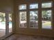 Sunroom with views of backyard outdoor kitchen and pool at 7261 Obannon Dr, Las Vegas, NV 89117