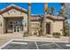 Exterior view of the community clubhouse with accessible entrance and mature landscaping at 8000 Badura Ave # 1020, Las Vegas, NV 89113