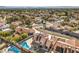Extensive aerial perspective highlighting a home's pool, patio, and roof solar panels within a residential area at 8304 Esmont Ln, Las Vegas, NV 89117