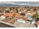 Expansive aerial shot showcasing a tile roof home with solar panels and a landscaped front yard in a residential area at 8304 Esmont Ln, Las Vegas, NV 89117