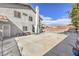 Backyard with an in-ground pool, concrete patio, and grassy area, perfect for outdoor activities at 8304 Esmont Ln, Las Vegas, NV 89117