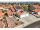 Two-story home showcasing a charming two-car garage, complemented by desert landscaping and a solar-paneled roof at 8304 Esmont Ln, Las Vegas, NV 89117