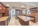 Well-appointed kitchen with granite countertops, island, and stainless steel appliances at 8304 Esmont Ln, Las Vegas, NV 89117