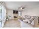 Comfortable living room featuring a fireplace and adjacent access to the outdoor pool at 8304 Esmont Ln, Las Vegas, NV 89117