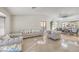 Bright living room area with tile floors, neutral paint, and stylish furnishings for a comfortable and modern feel at 8304 Esmont Ln, Las Vegas, NV 89117