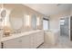 Spa bathroom features double sinks, large tub and marble floors at 8304 Esmont Ln, Las Vegas, NV 89117